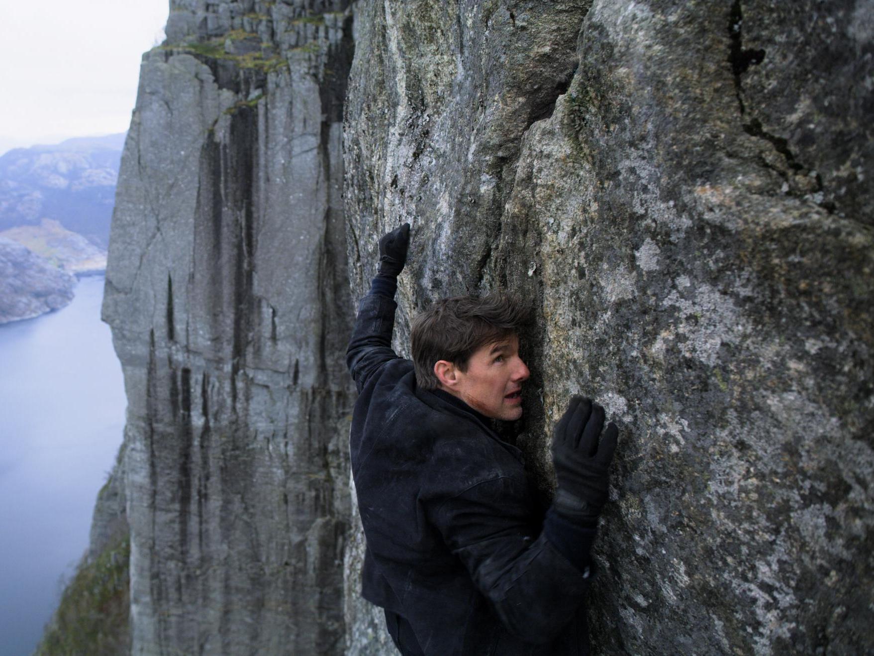 Ethan Hunt (Tom Cruise) clings to a cliff face in 2018’s ‘Mission: Impossible – Fallout’