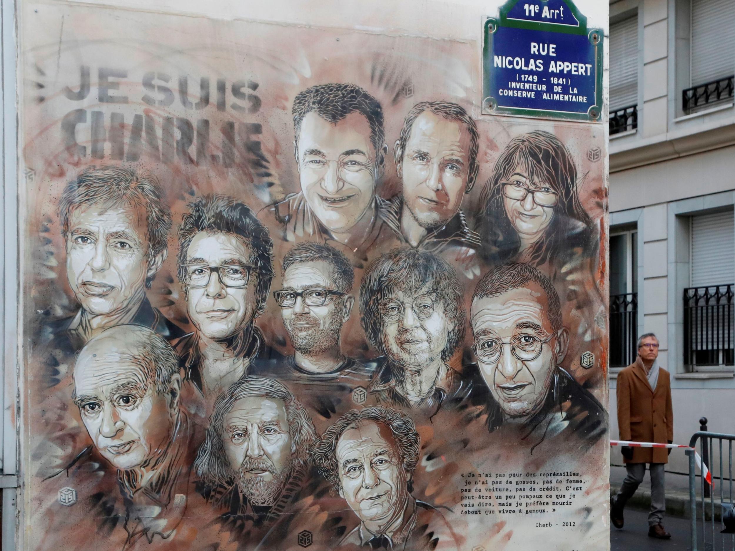 A mural near the Charlie Hebdo offices in Paris depicts staff who were killed in the January 2015 attacks