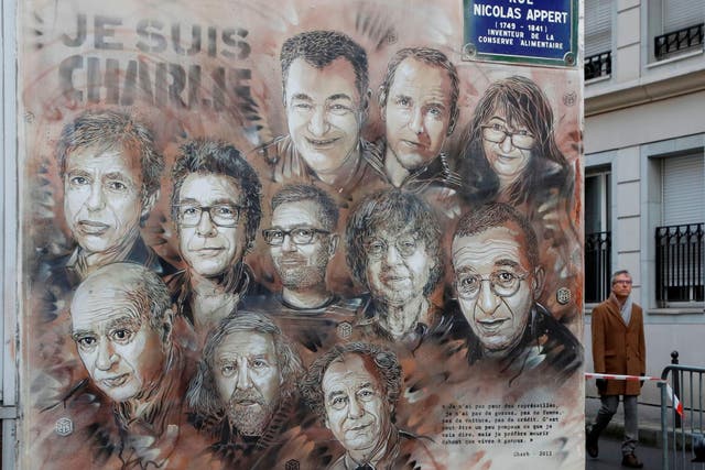 A mural near the Charlie Hebdo offices in Paris depicts staff who were killed in the January 2015 attacks