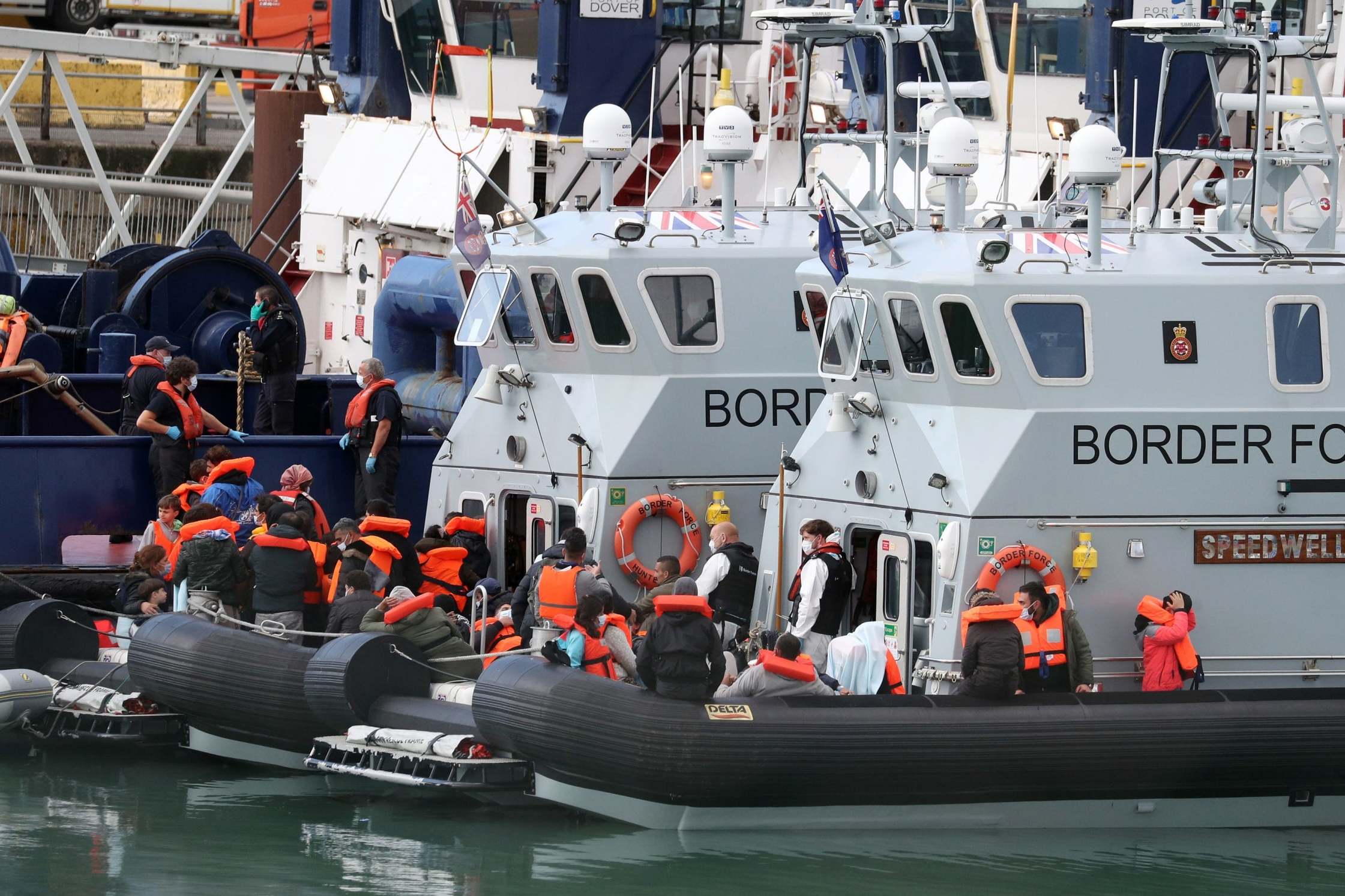 A group of people thought to be migrants are brought into Dover by Border Force officers following a small boat incident in the Channel, on Wednesday 2 September 2020