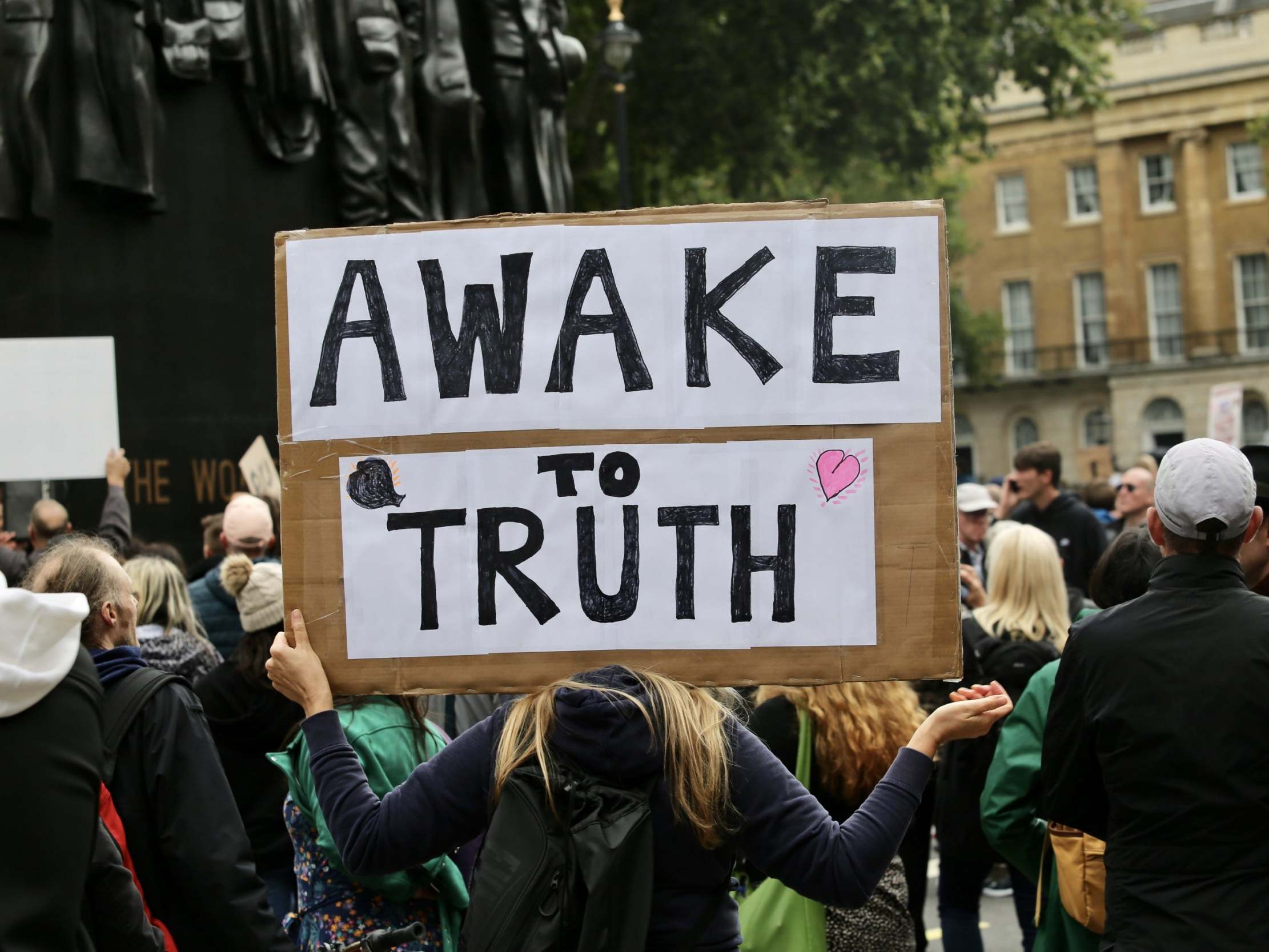 People gather at a protest dominated by conspiracy theorists in Trafalgar Square, London, on 29 August 2020