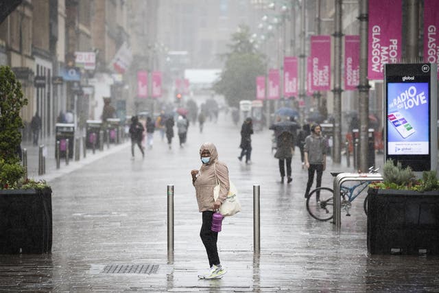 People get caught in heavy rain in the centre of Glasgow on 2 September, 2020.