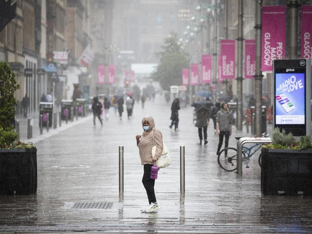 People get caught in heavy rain in the centre of Glasgow on 2 September, 2020.