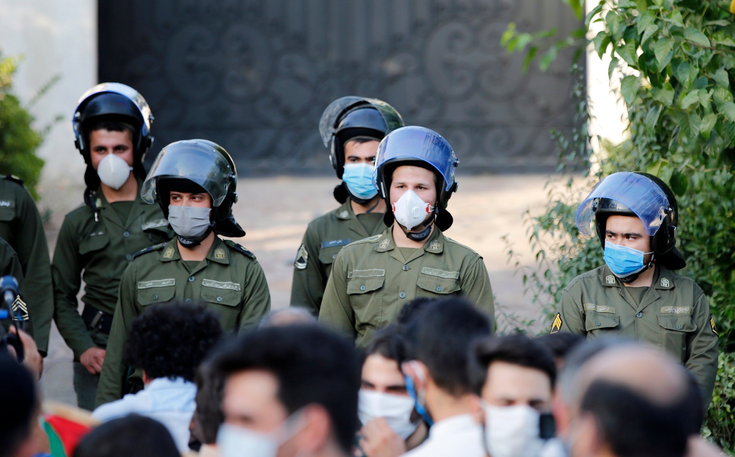 Iranian anti-riot police stand guard during protests in Tehran