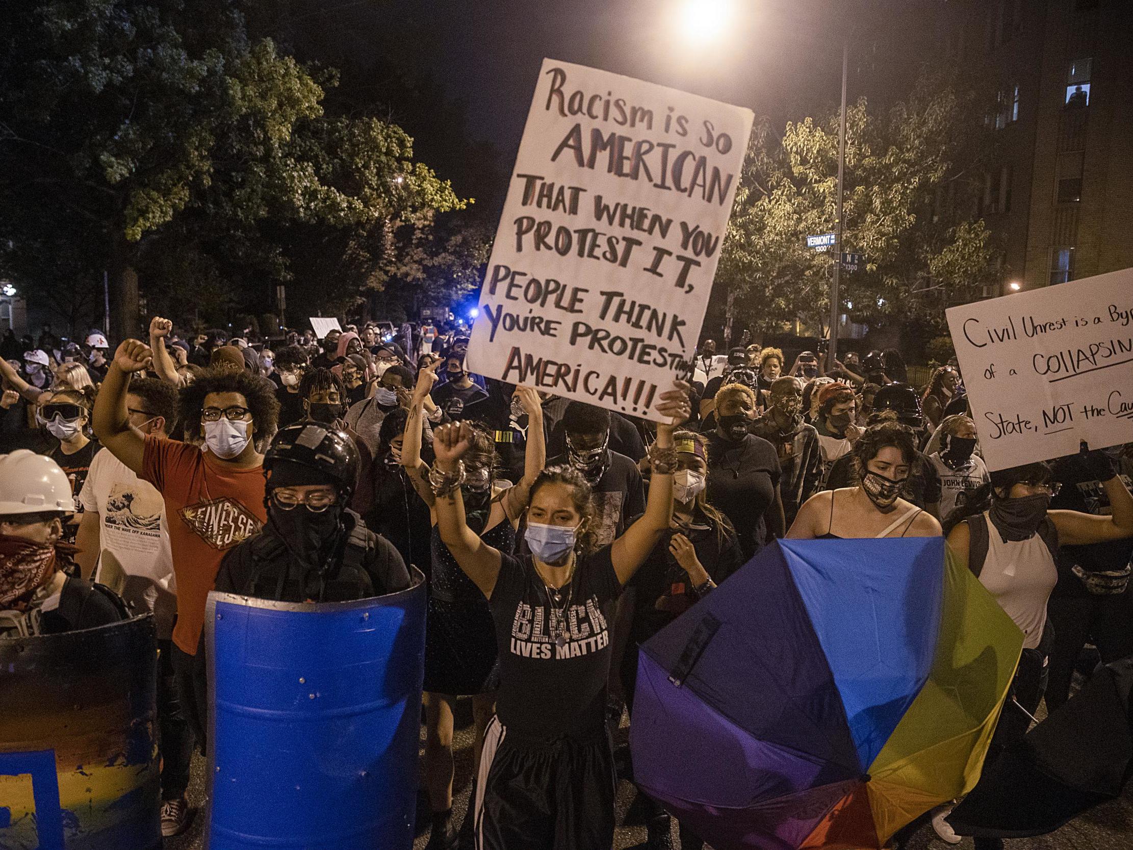Anti-Trump protesters march around downtown on 30 August 2020 in Washington, DC