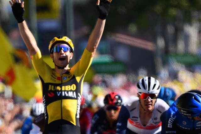 Wout van Aert celebrates winning the seventh stage of the Tour de France