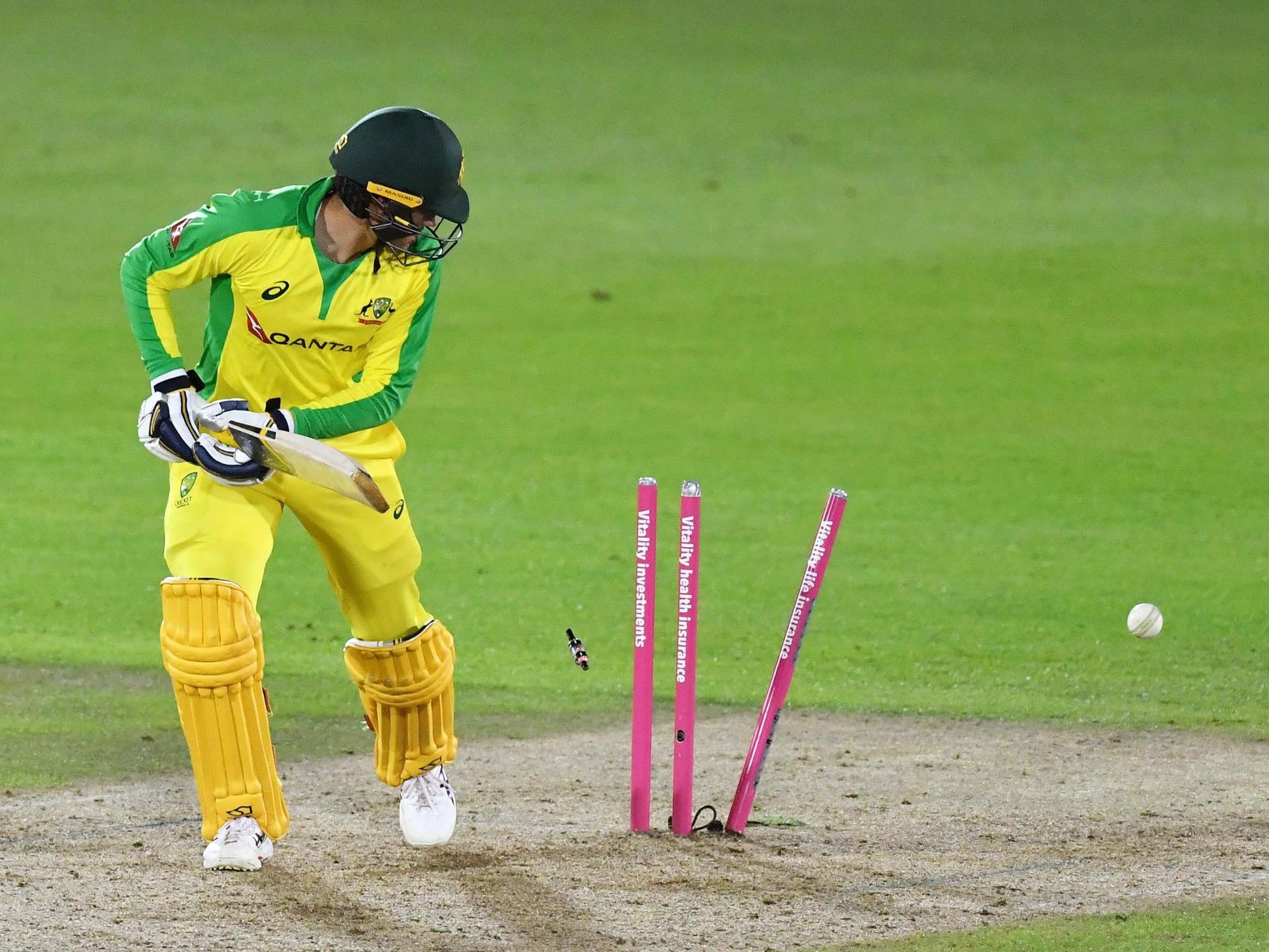 Alex Carey is bowled by Mark Wood as Australia come up short against England in a dramatic clash