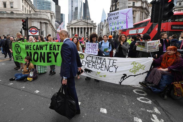 <p>Activists from Extinction Rebellion at a previous demonstration outside the Bank of England</p>