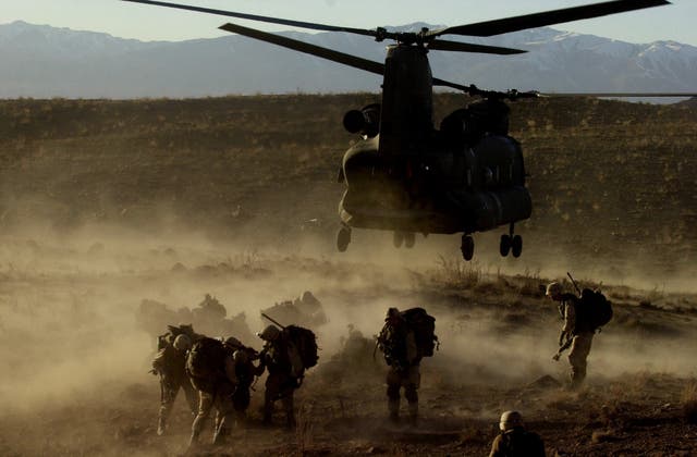<p>US troops being airlifted into mountainous battlefields in east Afghanistan in 2002 to fight the Taliban and al-Qaeda forces</p>