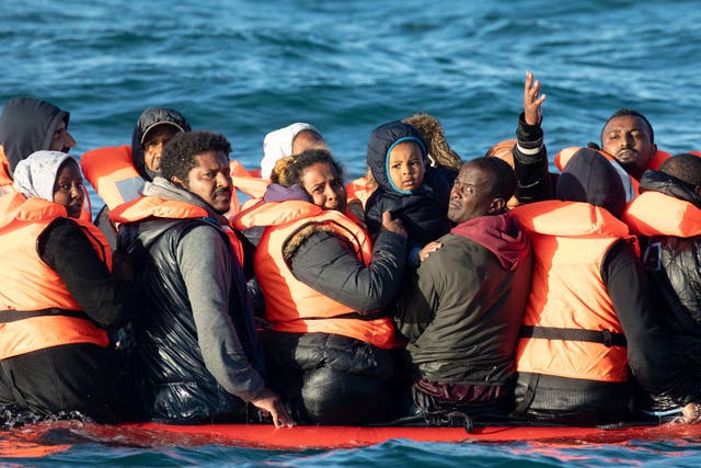 <p>People crossing the English Channel on an inflatable boat near Dover</p>