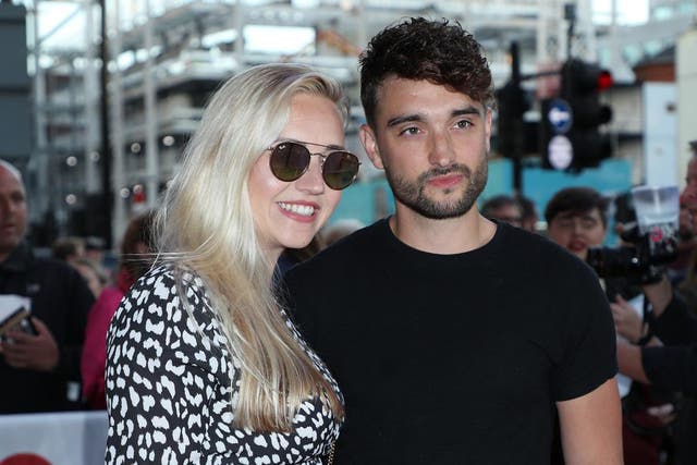 <p>The Wanted’s Tom Parker, here with wife Kelsey Hardwick, says he is already undergoing treatment</p>