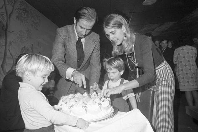 <p>Joe Biden and wife Neilia cut his 30th birthday cake at a party on 20 November 1972. Their son Hunter waits for the first piece</p>