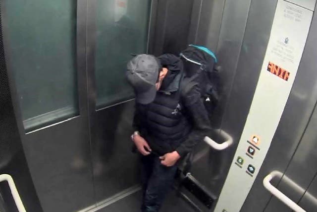 <p>Salman Abedi adjusting wiring underneath his clothing as he carries his suicide bomb in a lift at Manchester Arena shortly before the attack</p>