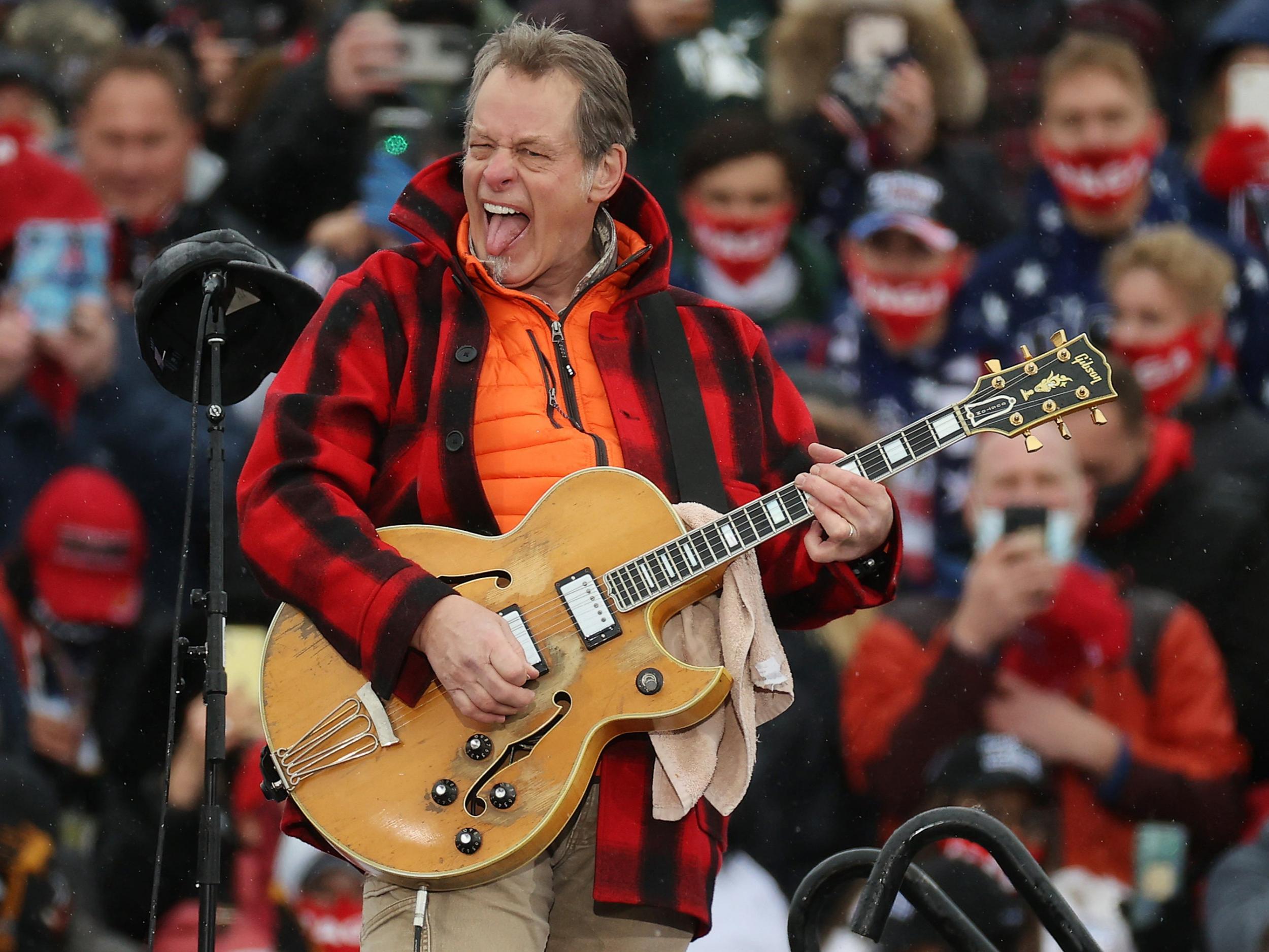 Ted Nugent performs ‘The Star-Spangled Banner’ during a Trump campaign rally in Lansing, Michigan (Ge