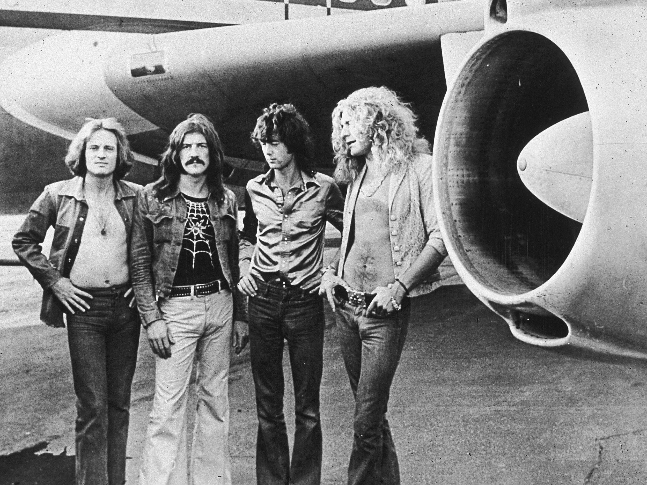 John Paul Jones, John Bonham, Jimmy Page and Robert Plant in front of their private airliner, The Starship, in 1973