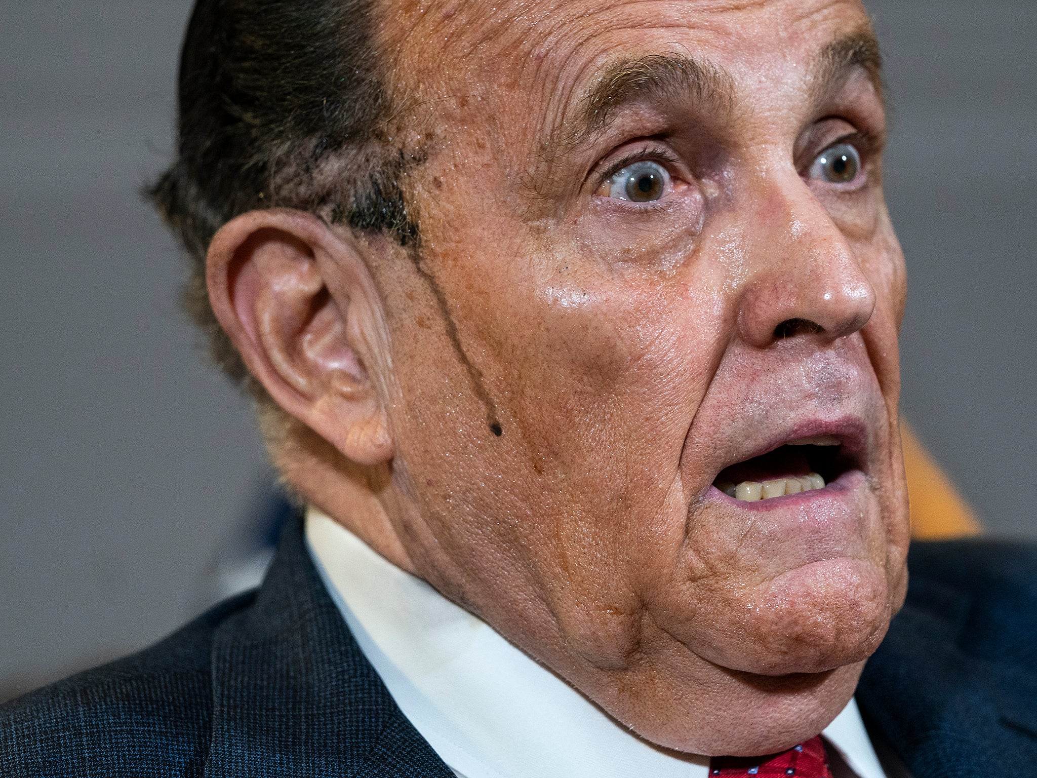 Hair dye runs down Giuliani’s cheek during a bizarre press conference in November 2020