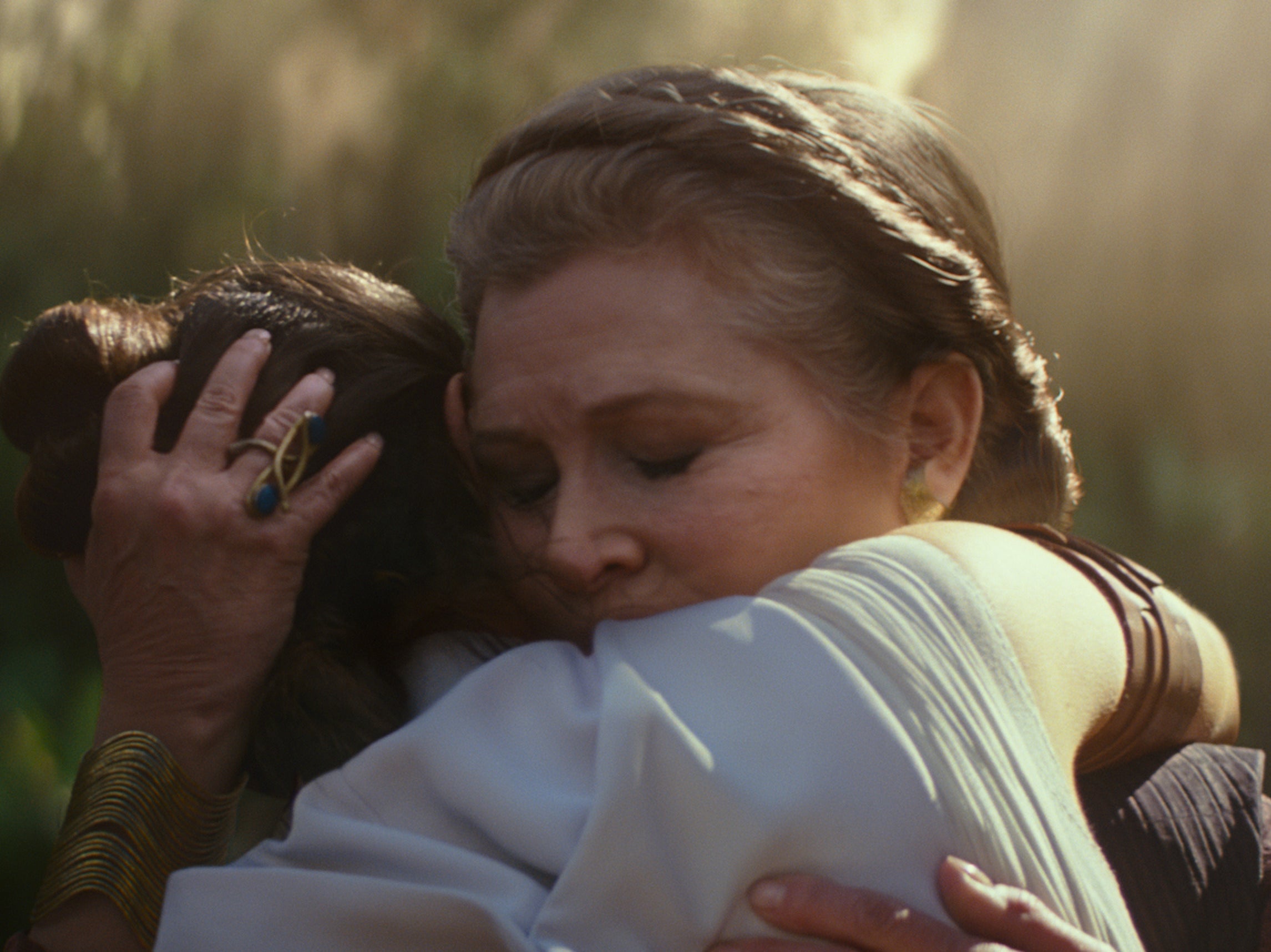 <p>A last goodbye: Leia (Carrie Fisher) embraces Rey (Daisy Ridley) in 2019’s The Rise of Skywalker</p>