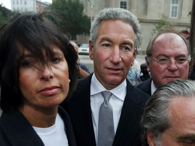 <p>Charles B Kushner is flanked by his wife, Seryl Beth, and legal team</p>
