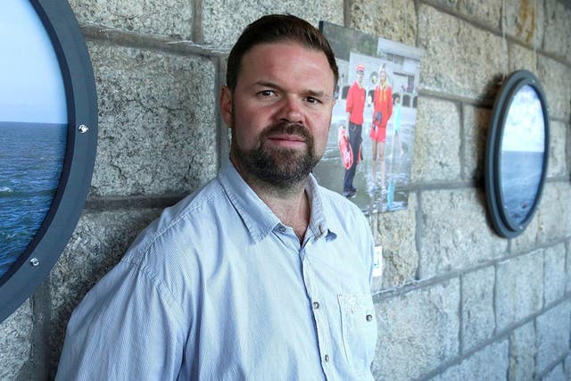 <p>Mr Aitchison was arrested after photographing a demonstration outside Napier Barracks in January </p>