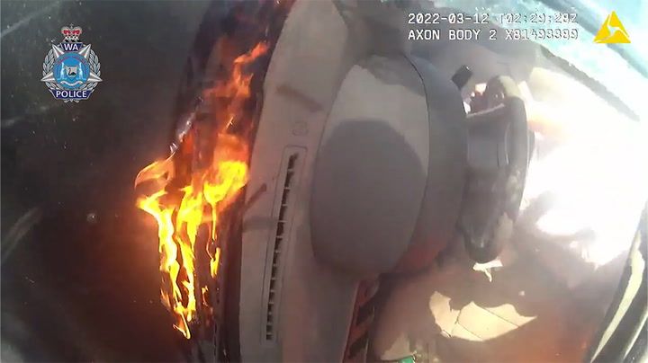 Two people pulled from a burning caravan seconds before it explodes
