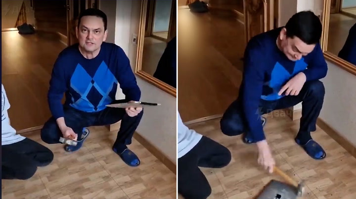Russian man smashes up his iPad in response to US sanctions