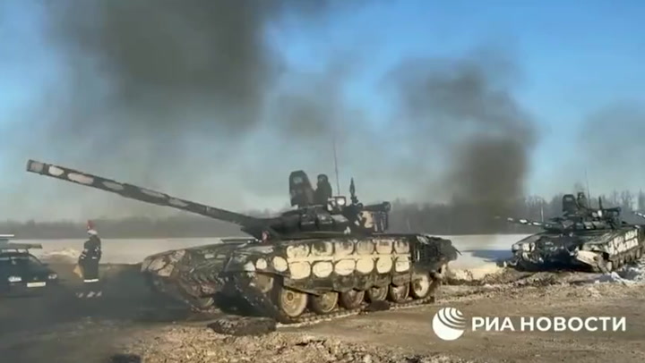 Russian tanks appear to return to their bases as Putin withdraws ‘some troops’