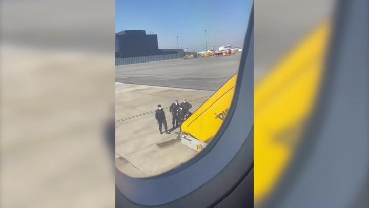 Jet2 passengers cheer as woman is marched off flight for 'slapping passengers'