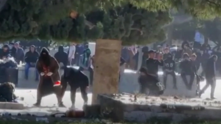 Police and Palestinian protesters clash at Al-Aqsa Mosque in Jerusalem