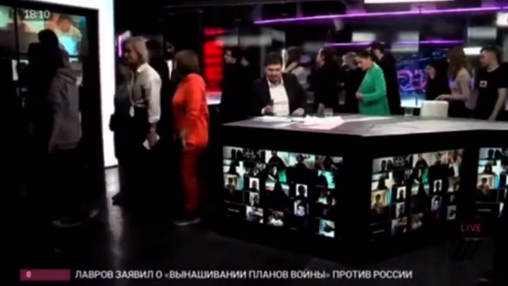 Russian TV station staff walk out live on air a being forced to stop showing programme