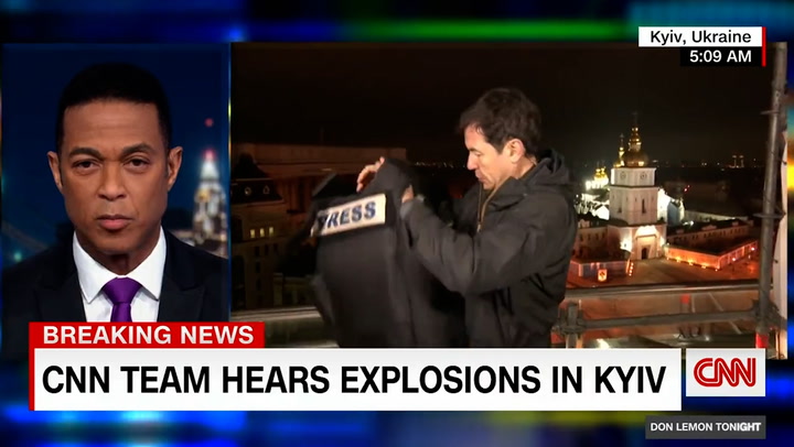 CNN reporter hears explosions in Kiev during live reporting, puts on flak jacket