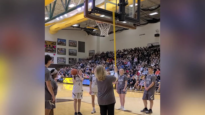 Blind girl scores in basketball game in front of huge crowd