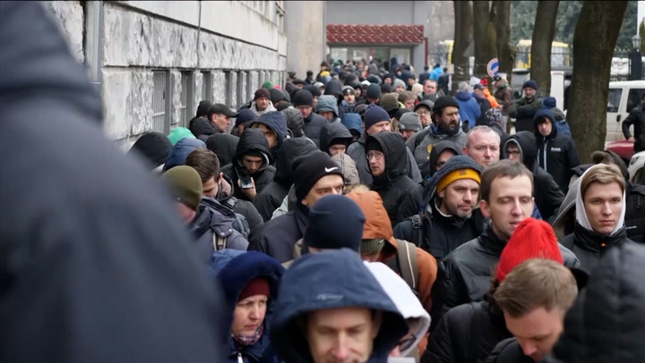 Men queue in Kyiv to sign up and join Ukraine army