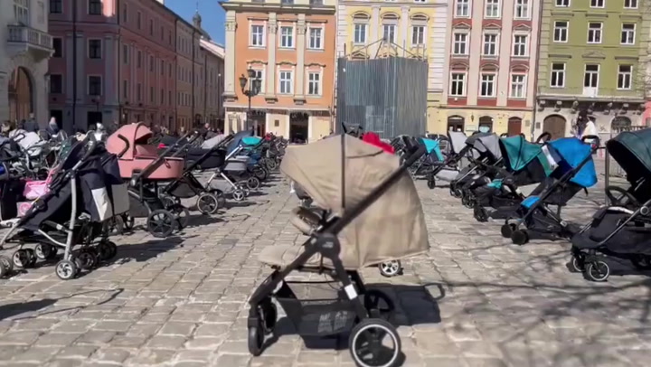 Ukrainians leave strollers in central Lviv to remember children killed in Russia's war