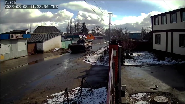 Russian tanks pass through village northeast of Kyiv