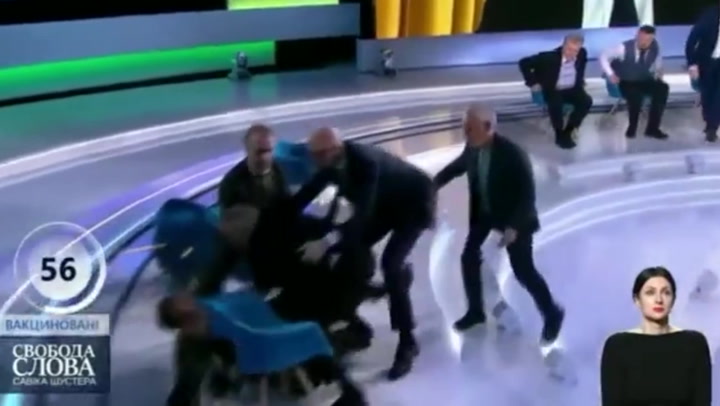 Ukrainian journalist punches politician and puts him in headlock on live TV