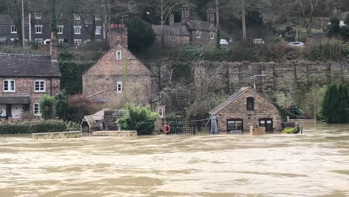 Houses alongside River Severn get flooded after high winds and wet weather hit the UK
