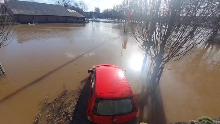 Cars are stranded in York after River Ouse overtopped its banks