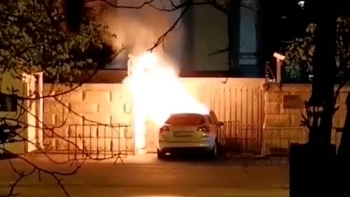 Car bursts into flames after crashing into gates of Russian embassy in Bucharest