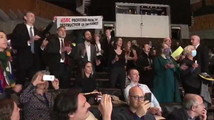 Singing climate protesters disrupt HSBC's annual general meeting