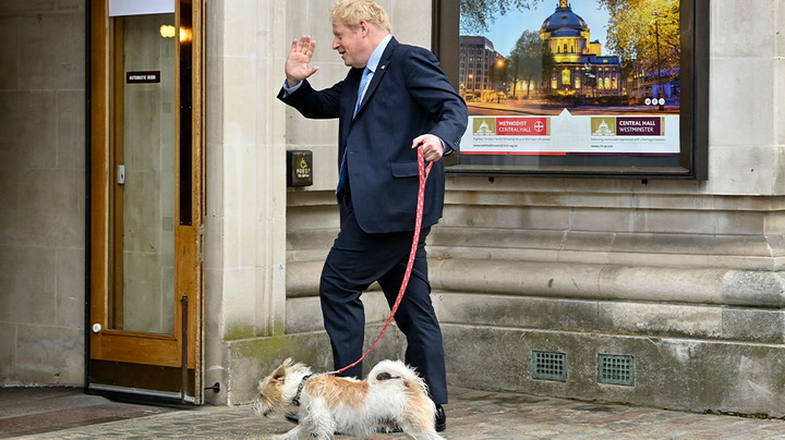 Boris Johnson casts his vote in local elections with his dog Dilyn