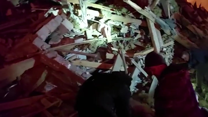 Rescue workers dig through debris in Zhytomyr after Russian missile strike