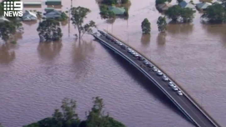 Residents and their horses trapped overnight on a bridge in Australia after flood